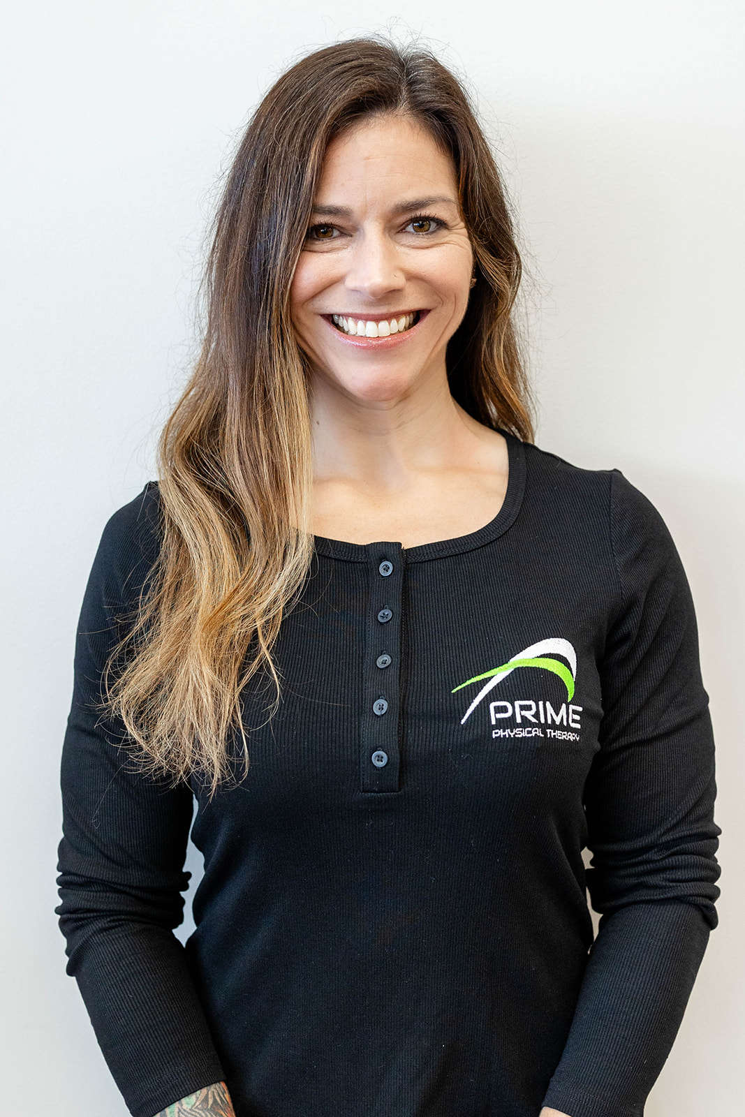 PRIME PT Course instructor Dr. Tami scales a rope at a CrossFit competition.